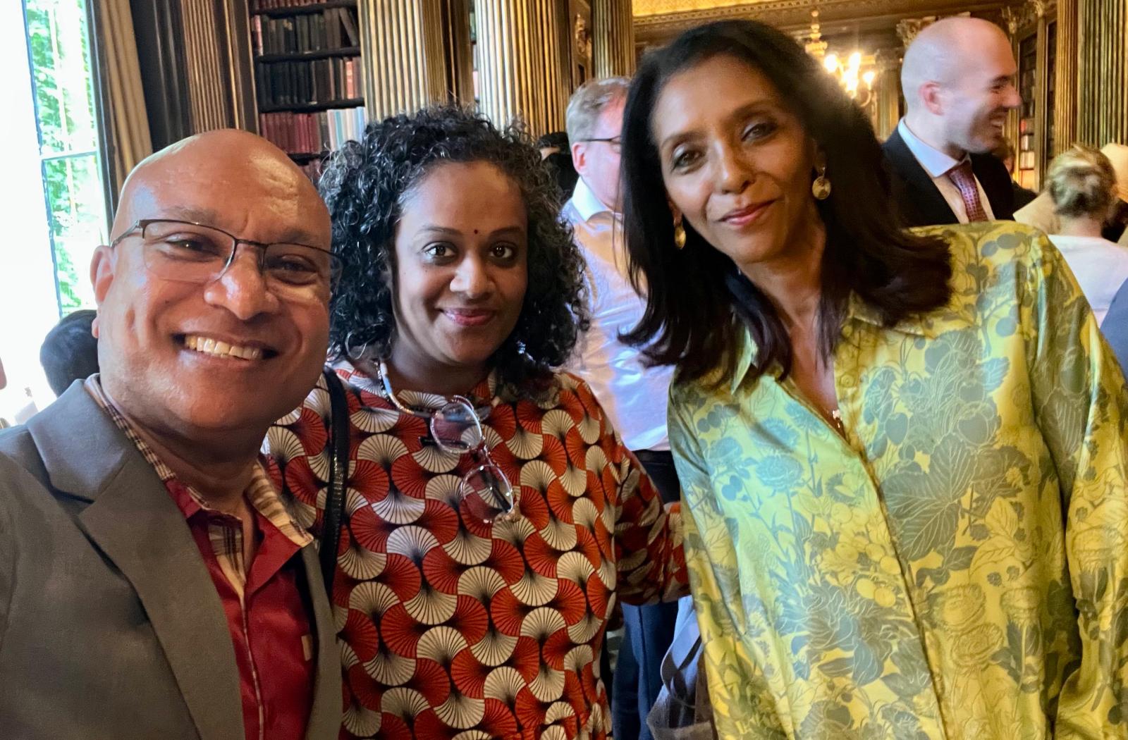 three people posing for a selfie picture