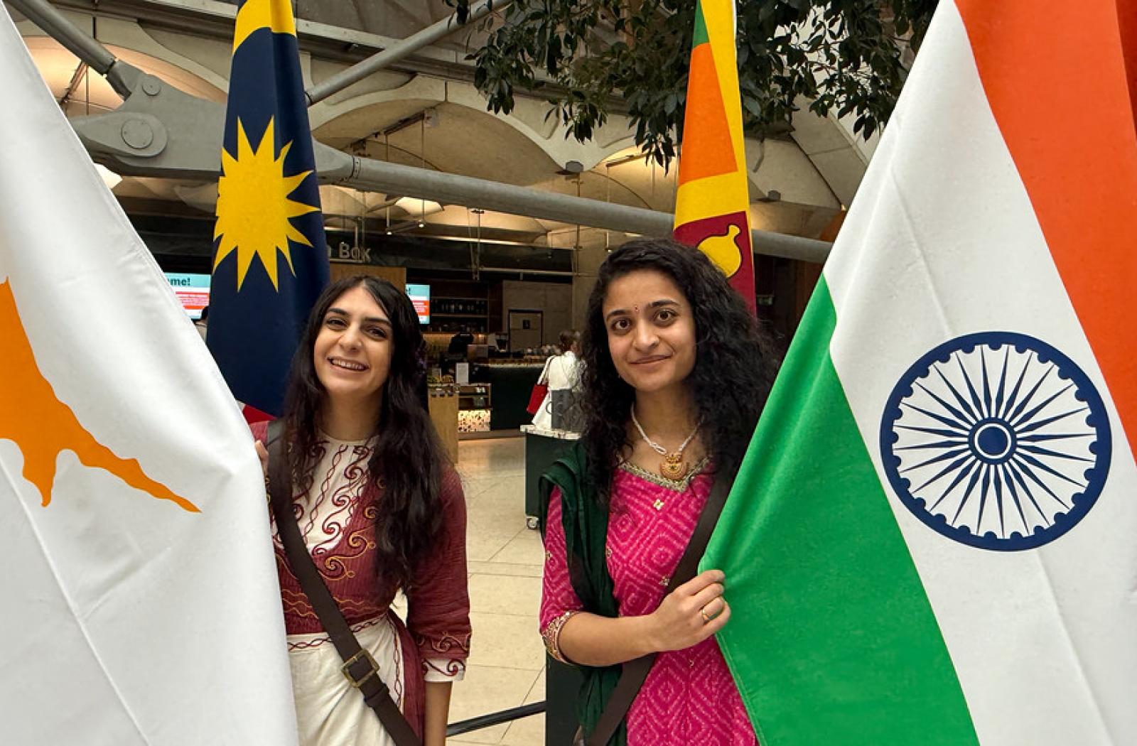 Two flagbearers at the Commonwealth flag raising in UK Parliament