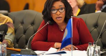 Commonwealth Secretary-General speaking into microphone at the Commonwealth Trade Ministers Meeting