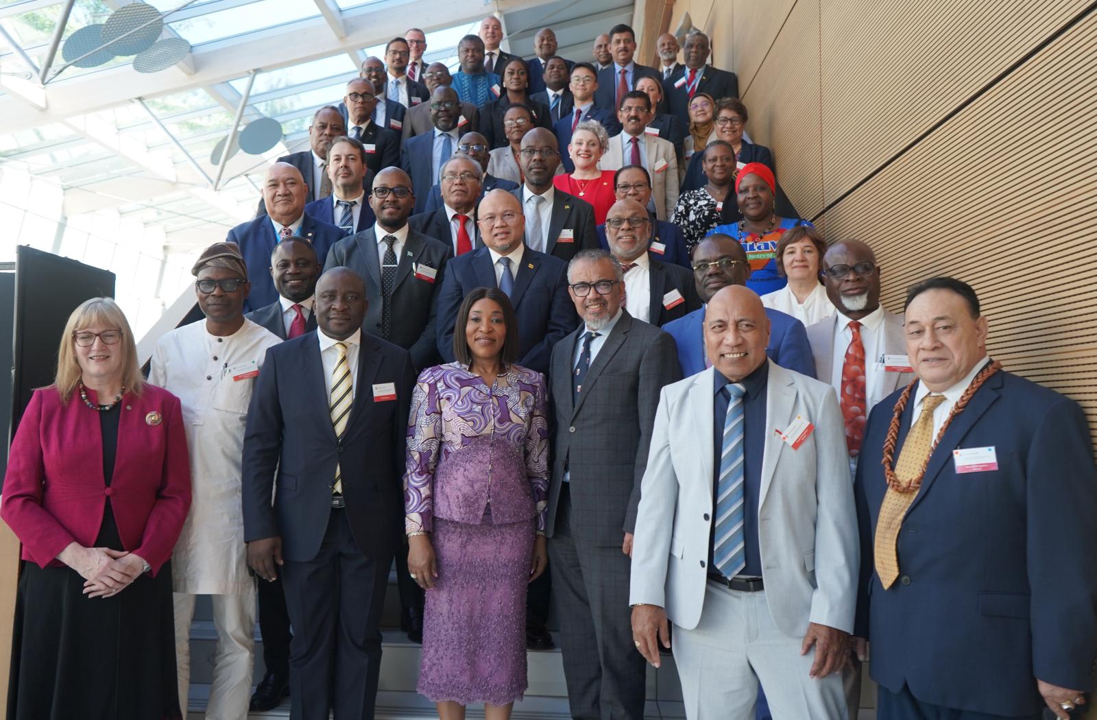 Standing group shot of Commonwealth Health Ministers and Secretary General Botchwey