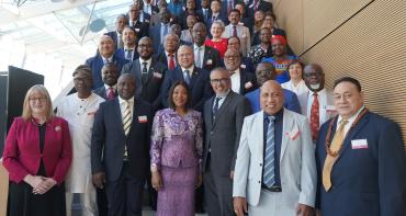 Standing group shot of Commonwealth Health Ministers and Secretary General Botchwey