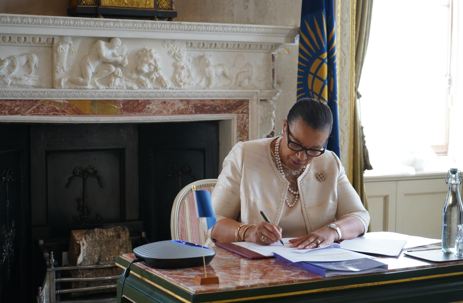 Secretary-General signing the MOU