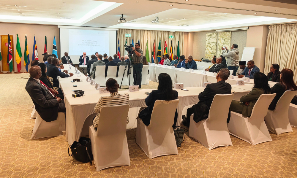Heads of anti-corruption agencies sit around a table during their training