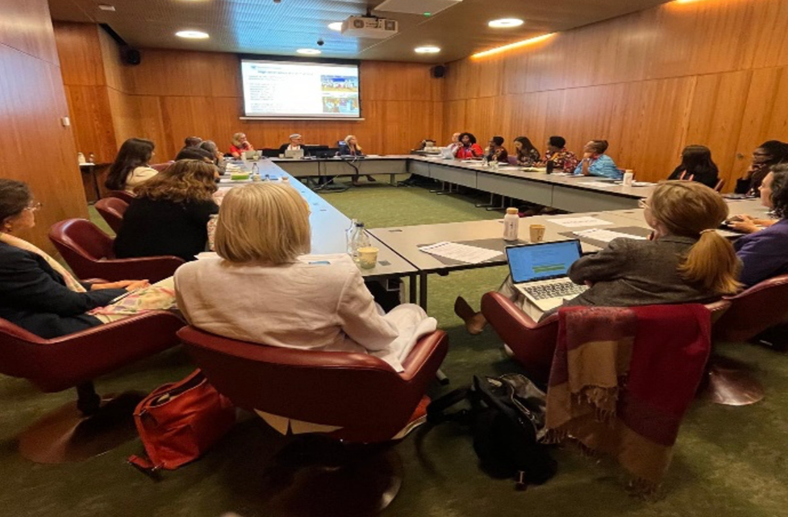 The World Cancer Congress Meeting people sat around table